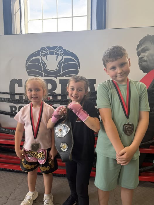 Find me a more positive picture of 3 kids enjoying themselves, having fun, getting fit and